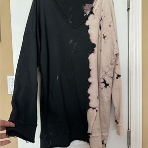 V-Neck Black and Cream Sweater with Artistic Two-Tone Design